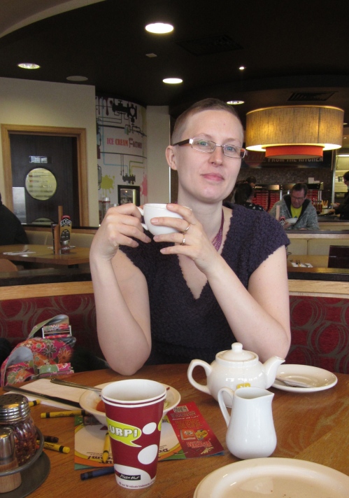 The elegant skinhead downing a  cup of tea look. 